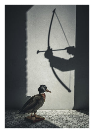 The hunt by Lone Gjessing - a stuffed duck under the shadow of an archer with a drawn bow