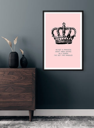 Framed "I'm a Queen" poster with a crown illustration on a pink background, displayed above a wooden dresser.