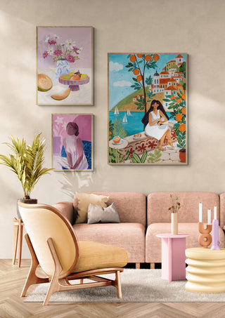 Pastel living room with modern furniture and Mediterranean-themed wall art featuring a woman by the sea.