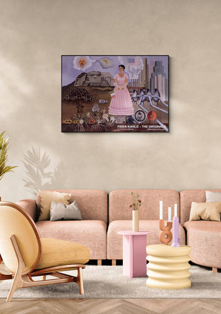 Frida Kahlo’s "The Border of Mexico" painting displayed above a beige sofa in a modern living room.