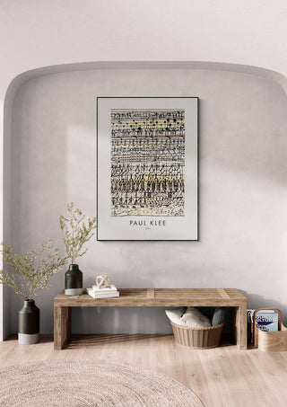 Framed "Cooling in a hot zone garden 1924 - Paul Klee" art print displayed above a bench in a modern room.