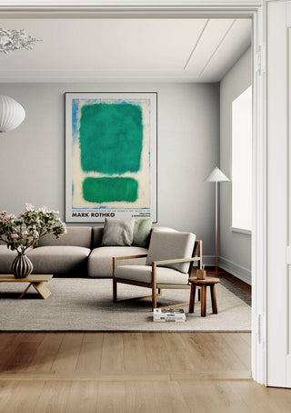 Framed Rothko Green Retroperspective artwork hanging above a modern beige sofa in a bright living room.