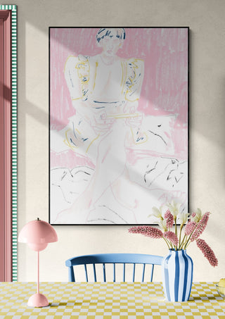 Framed pastel artwork featuring a stylized girl, displayed above a blue chair and checkered table with flowers.