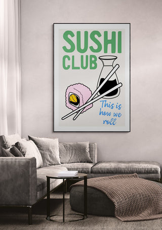 Sushi Club wallchart with sushi, soy sauce, and chopsticks on a living room wall; text reads "This is how we roll."