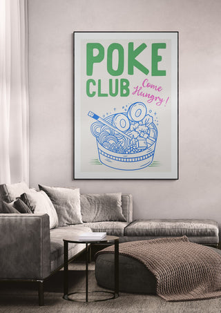 Framed "Poke Club - Come Hungry!" wallchart featuring poke bowl illustration, displayed in a modern living room.
