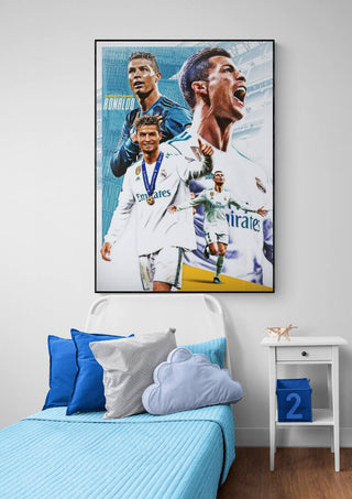 Poster of Cristiano Ronaldo in Real Madrid kit above a bed with blue-themed bedding and pillows.