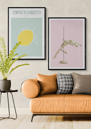 Framed Limone di Sorrento lemon art by ByKammille displayed above a modern tan sofa in a stylish living room.