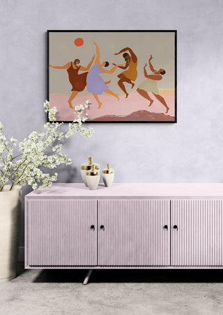 Together - Arty Guava art print featuring dancing abstract figures, displayed above a modern sideboard.
