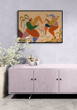 Sisters of the Rhythm - Arty Guava framed artwork above a modern sideboard with decorative accents.