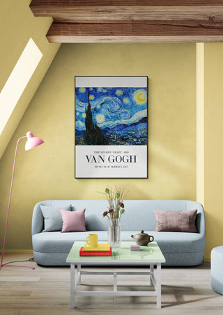 Starry Night Over the Rhone by Van Gogh framed on a yellow wall above a modern sofa in a cozy living room.