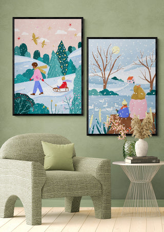 Wall art of snowy winter scenes by Bea Muller, featuring children sledding and a family enjoying the snow.