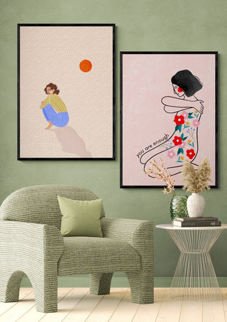 Framed Alone - Bea Muller art print on a green wall above a modern chair and side table with vases.