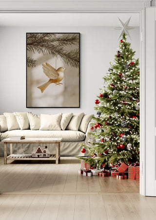 Golden Bird wall art displayed in a cozy living room with a decorated Christmas tree and wrapped gifts.