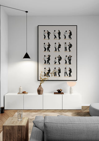 Framed "Pulp Fiction 2 - Nour Tohme" artwork displayed above modern white sideboard in a minimalist living room.