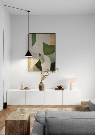Abstract painting "Reflections of the Soul" hangs above a minimalist white cabinet in a modern living room.