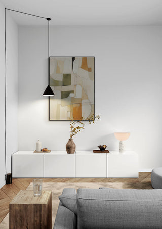 Etheric Melody abstract art hangs above a modern white sideboard in a minimalist living room setting.