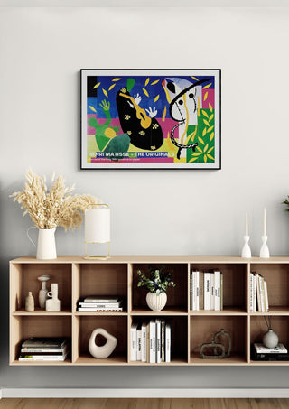 Sorrow of The King 1952 by Henri Matisse framed on a modern living room wall above a bookshelf.