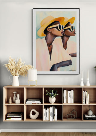 Hey Look by David Wolf art print featuring two stylish figures in hats and sunglasses, displayed above modern shelf.