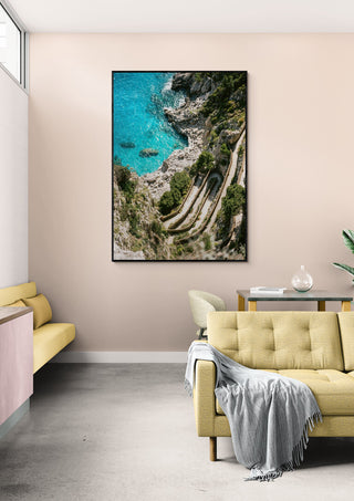 Framed aerial photo of Gardens of Augustus coastline displayed in a modern living room.