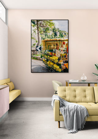 Framed Amalfi Coast Drive XV print on a beige wall above a stylish, modern living room interior.