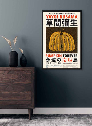 Framed "Pumpkin Forever" Yayoi Kusama poster featuring a yellow pumpkin with Japanese and English text.
