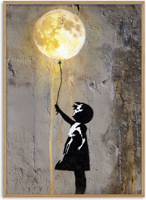 Moon Balloon by Decker Studios - stencilled girl in a black dress reaching for a glowing moon on a string on a concrete wall