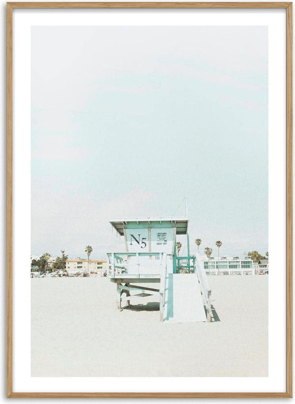Minimalist beach tower with "N5" sign, sandy foreground, pastel sky; Beach Tower Naturposter product image.