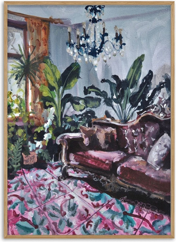 Living room with Maltese tiles by Mariam De Giorgio — a burgundy carved sofa and green plants above a pink and teal patterned tile floor