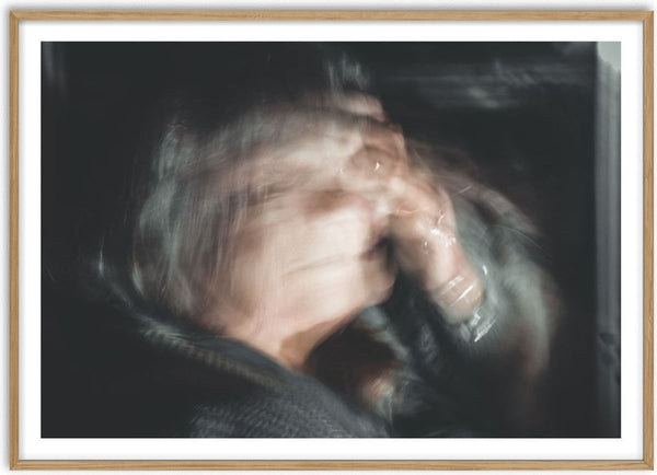 Only human by Lone Gjessing - a figure with hands to the face, blurred by a long exposure