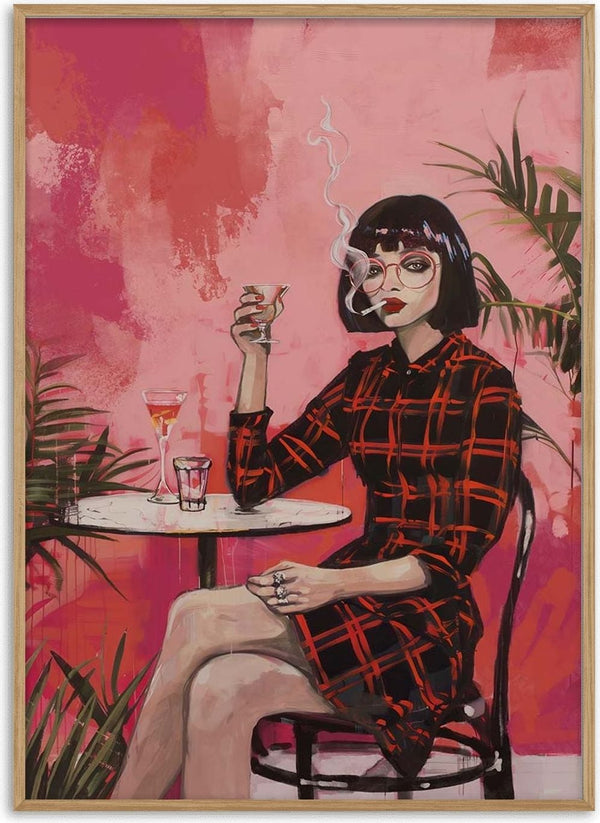 Woman in a red plaid dress smoking and holding a drink at a table, with pink background and green plants.