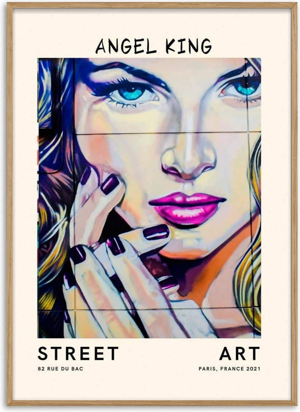 Colorful street art poster of a woman's face with bright blue eyes and pink lips, titled "Angel King no.2".