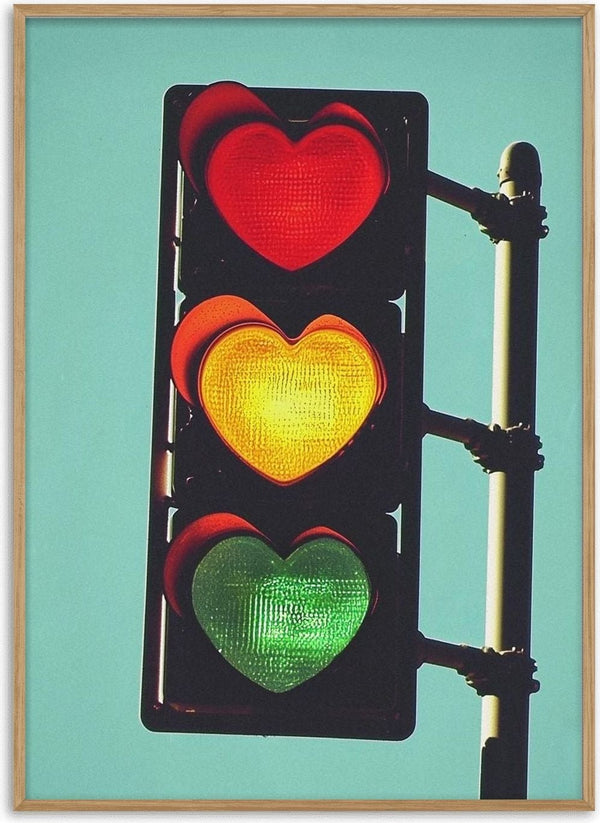 Traffic light with heart-shaped red, yellow, and green signals against a blue sky for Traffic Light In Love.