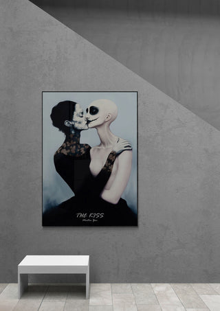Framed "The Kiss 2025" by Martin Zen displayed on a gray wall above a white bench.